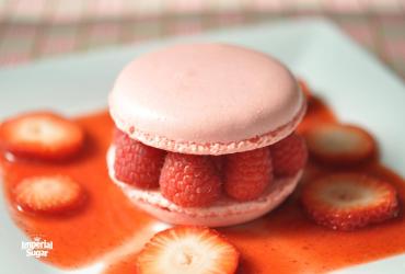 Raspberry Macarons with Chocolate Ganache and Strawberry Sauce 